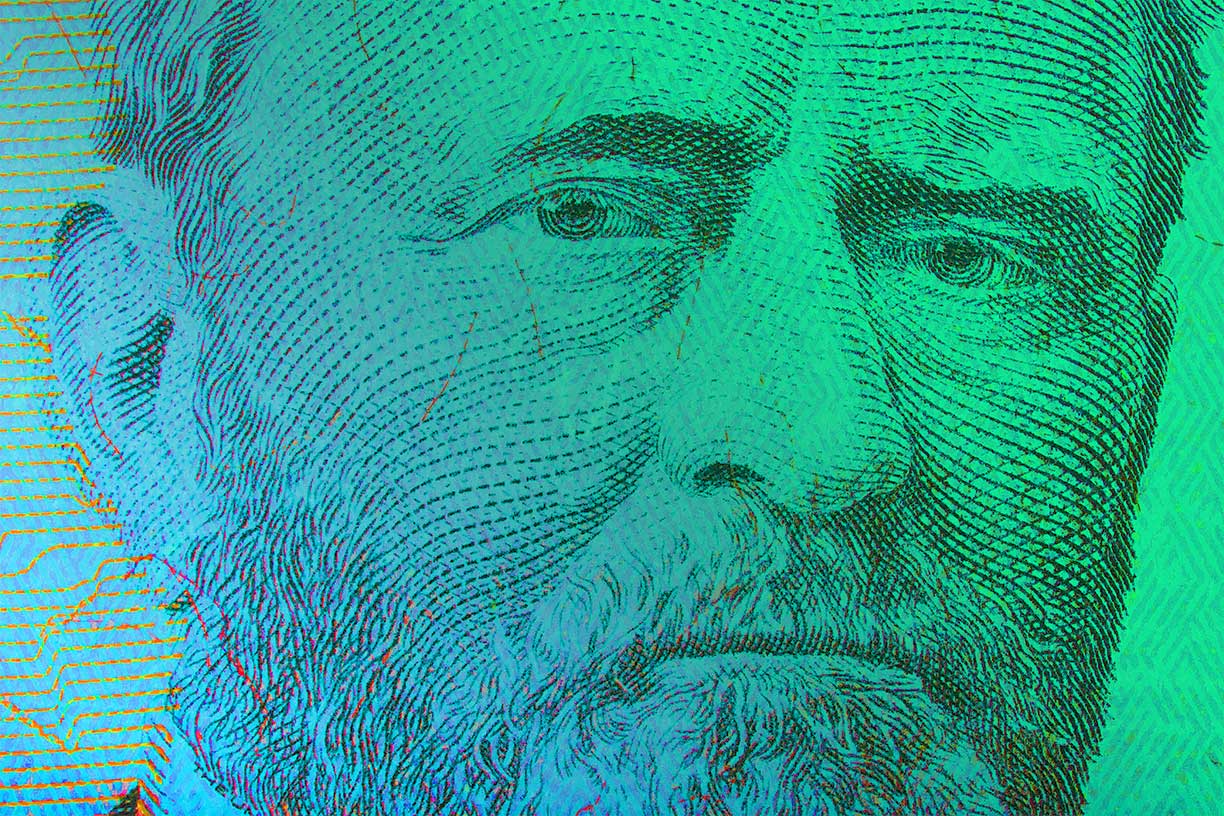 Close up of one hundred bill Franklin portrait focus on eyes