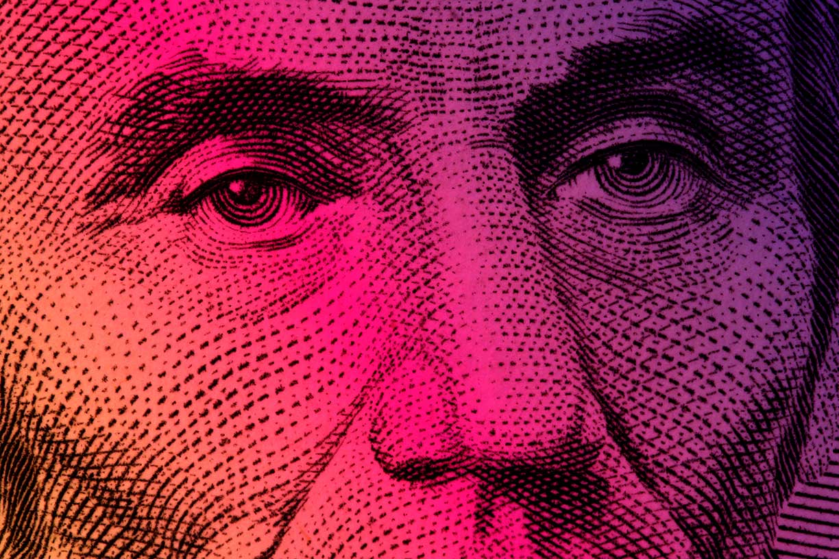 Close up of one hundred bill Franklin portrait focus on eyes